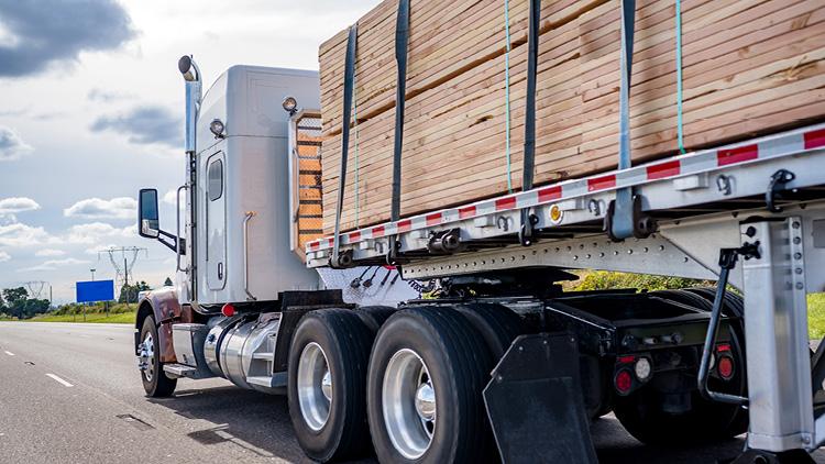 Close up of truck carrying wood